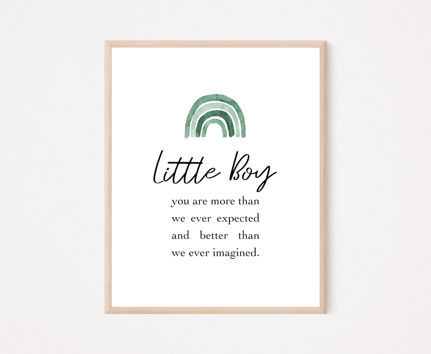 A frame showing a graphic for a little boy’s room displaying a rainbow design in different shades of green and includes a piece of writing that says: Little boy, you are more than we ever expected and better than we ever imagined.