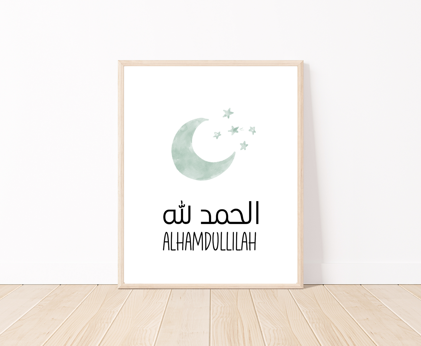A digital poster that is placed on a white wall and parquet flooring shows a baby green crescent and some tiny stars with “Alhamdulillah” written in both Arabic and English right below.