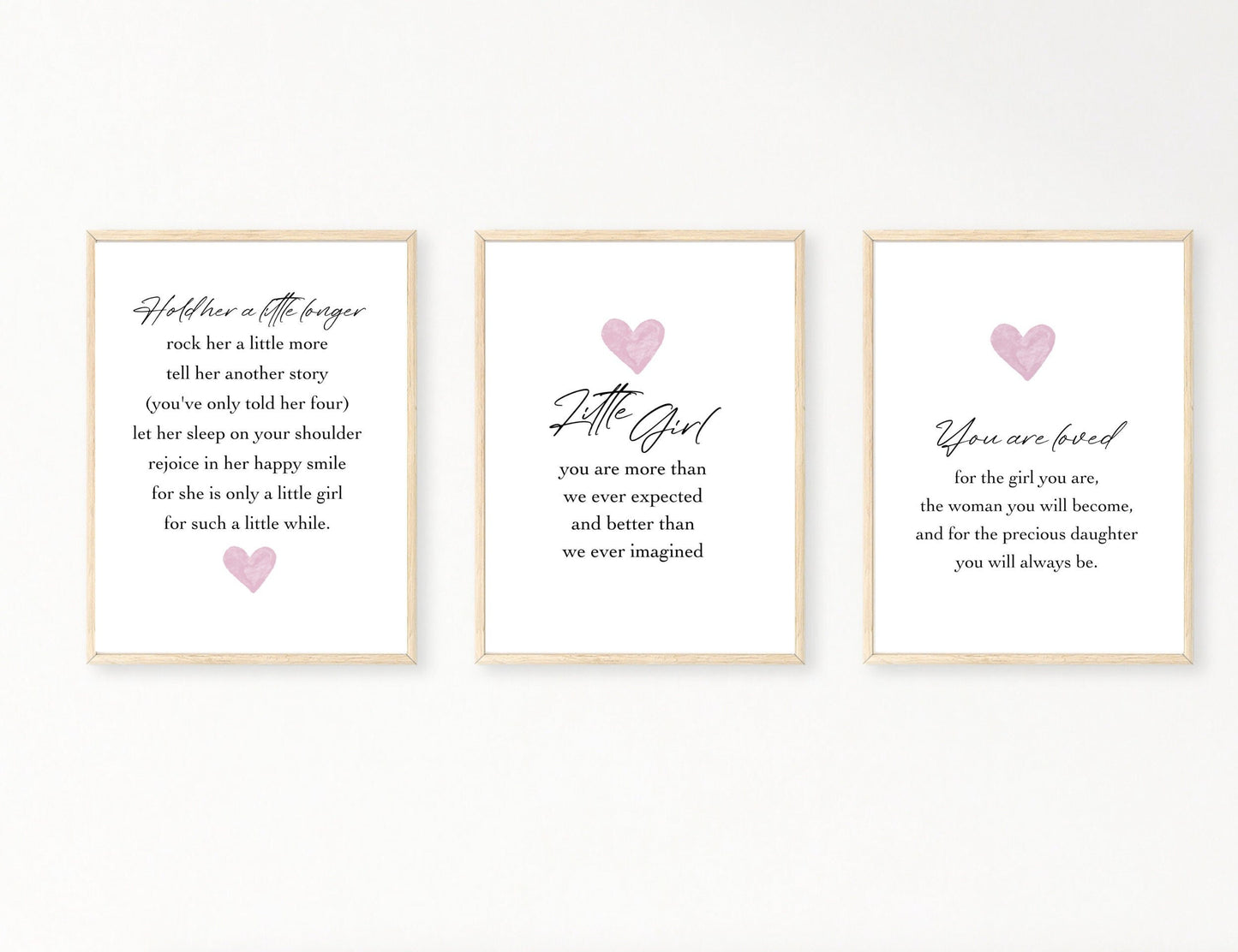 Three frames for a baby girl’s room graphics. The first one has a pink heart below the piece of writing. The middle graphic shows a pink heart with a piece of writing below that says: little girl you are more than we ever expected and better than we ever imagined. The last one shows a pink heart with a piece of writing below that says: You are loved for the girl you are, the woman you will become, and for the precious daughter you will always be.