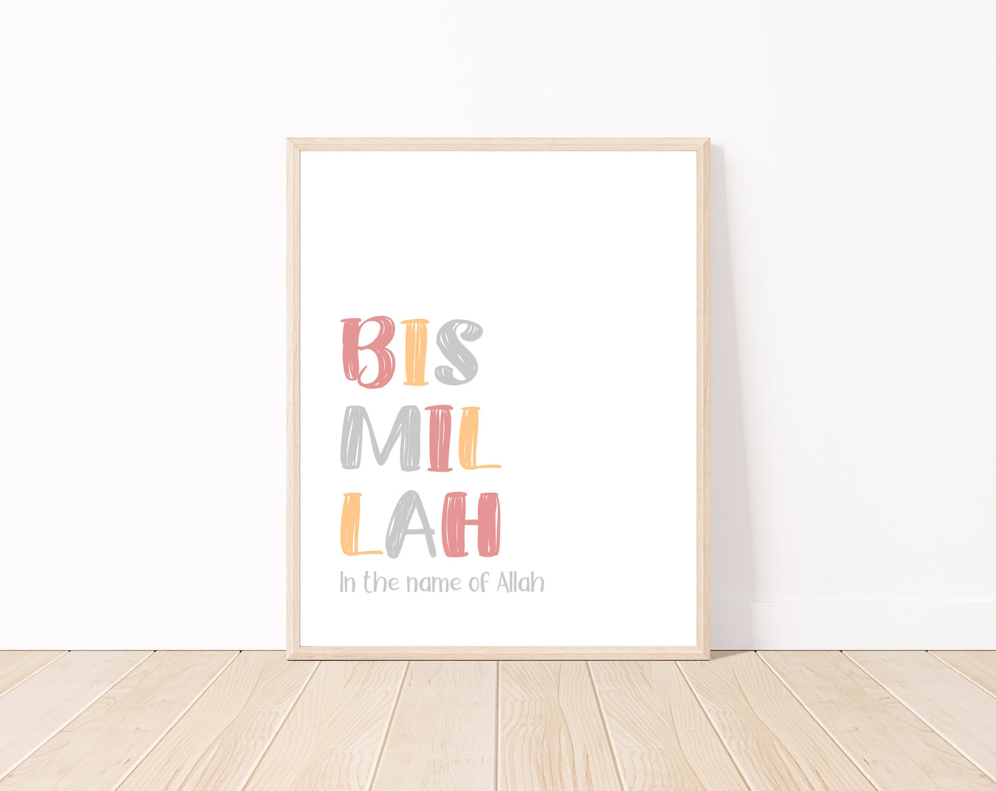 A digital print is placed on a white wall and parquet flooring. It includes “Bismillah, in the name of Allah” written in multi-colored letters with a white background.