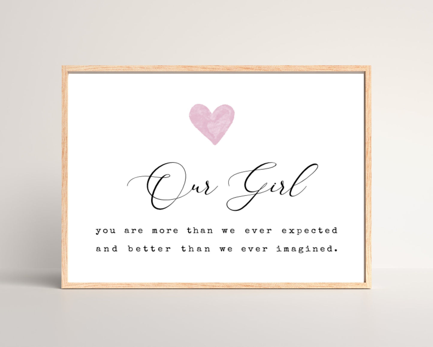 A little girl’s room digital print that has a pink heart at the top, and a piece of writing that says: “Our girl, you are more than we ever expected and better than we ever imagined.”