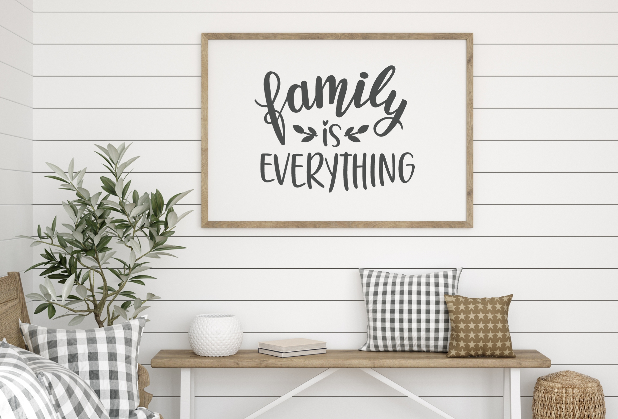 Farmhouse bench with pillows and wall frame that reads "Family is everything."