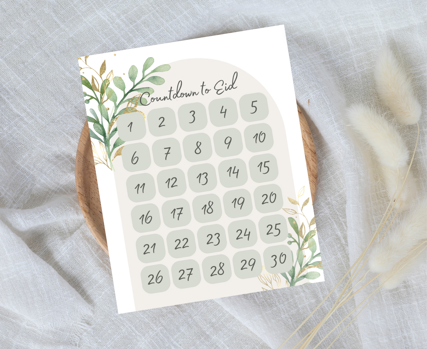  Countdown to Eid print on a neutral cloth background and round wooden tray. 