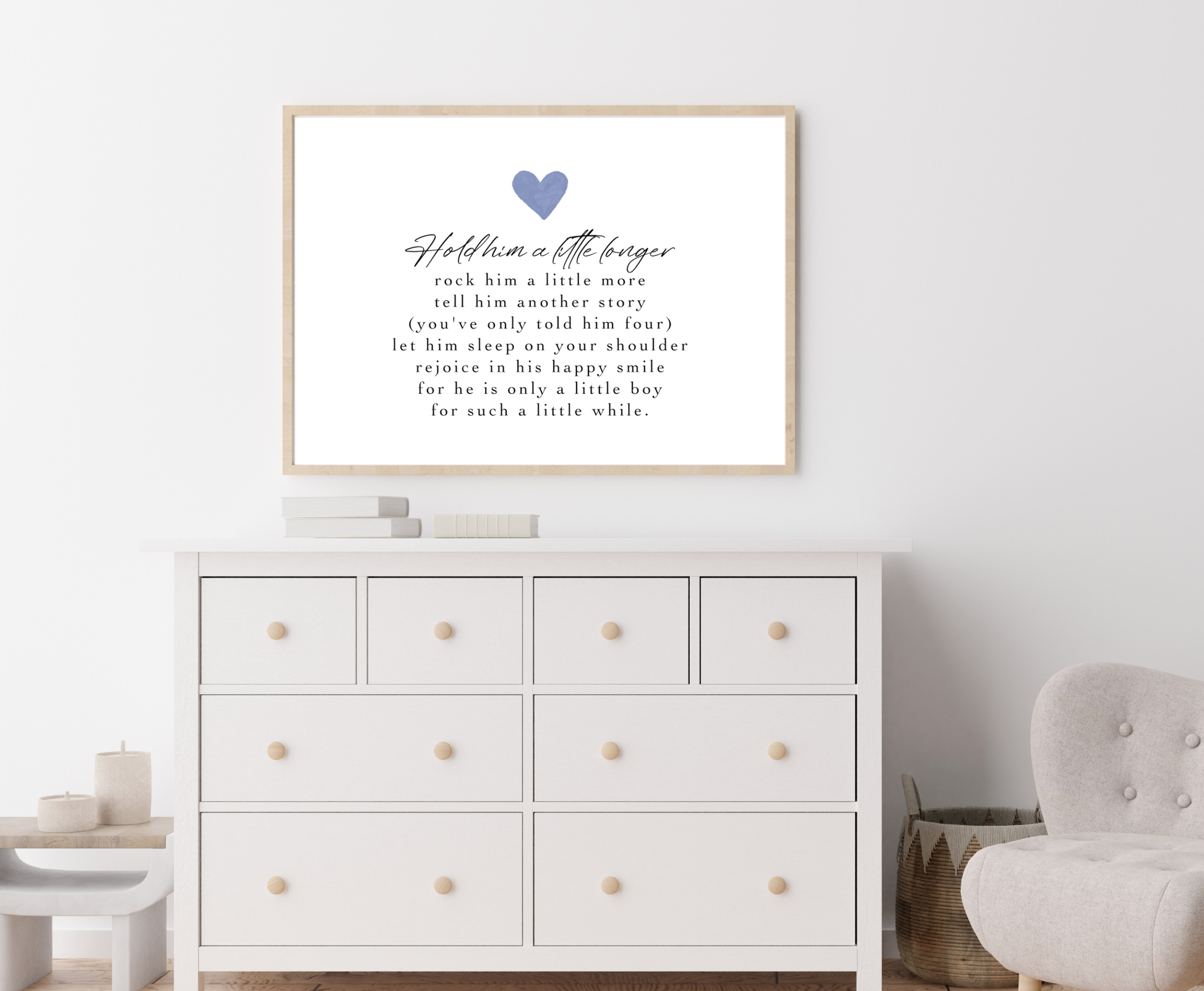 A digital print is placed above a nursery wardrobe. The digital print has a blue heart at the top and a piece of writing that says: Hold him a little longer, rock him a little more, tell him another story, (you have only told him four), let him sleep on your shoulder, rejoice in his happy smile, for he is only a little boy, for such a little while.