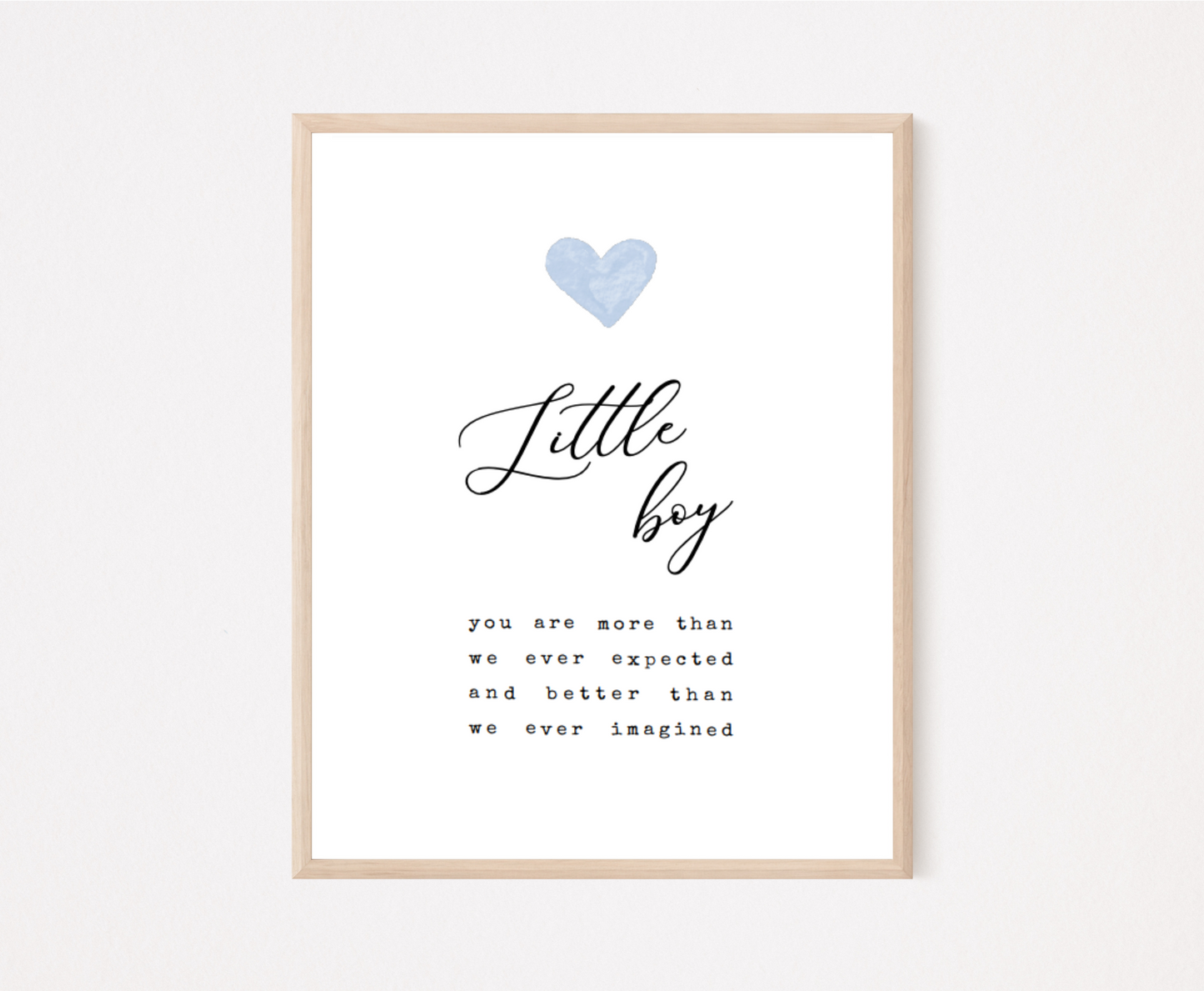 A frame displaying a baby blue heart with a piece of writing below that says: Little boy, you are more than we ever expected and better than we ever imagined.
