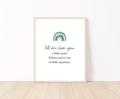 A digital placed on the floor showing a green ombre rainbow on top with a piece of writing below saying: let me love you a little more before you are not little anymore. 
