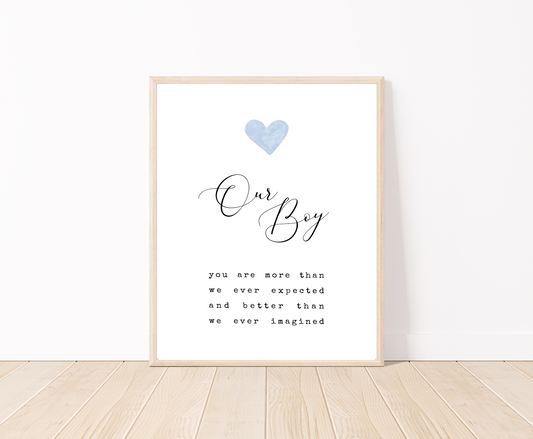 A frame showing a digital poster for a little boy’s room. It has a blue heart on top, with the words “Our Boy” written below, and a piece of writing that says: You are more than we ever expected, and better than we ever imagined.