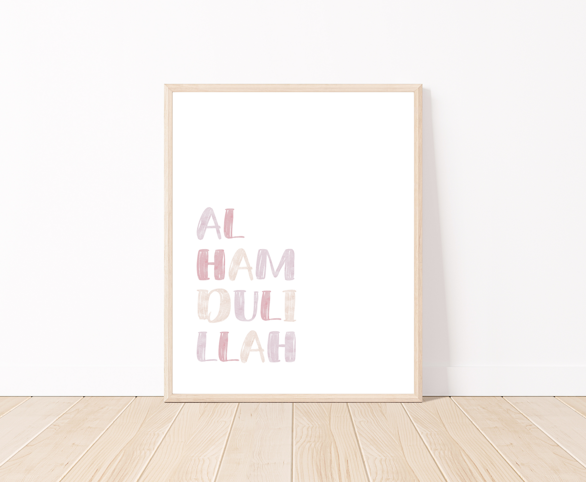 A little girl’s room digital print is placed on a white wall and parquet flooring. It includes “Alhamdulillah” written in upper case and multi-colored letters with a white background.