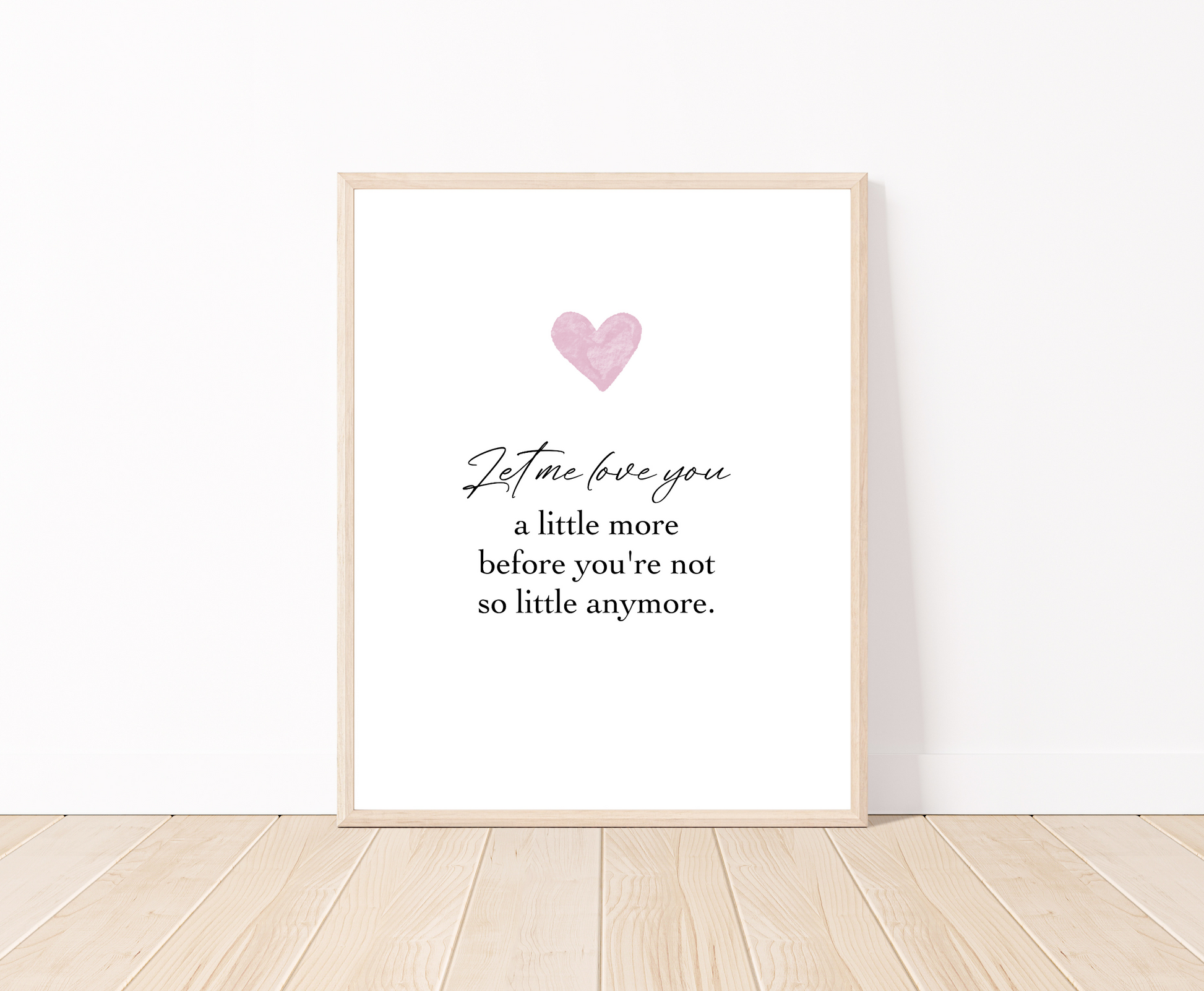 A digital poster is placed on a white wall and parquet flooring and has a pink heart at the top with a piece of writing that says: “Let me love you, a little more before you’re not so little anymore.”