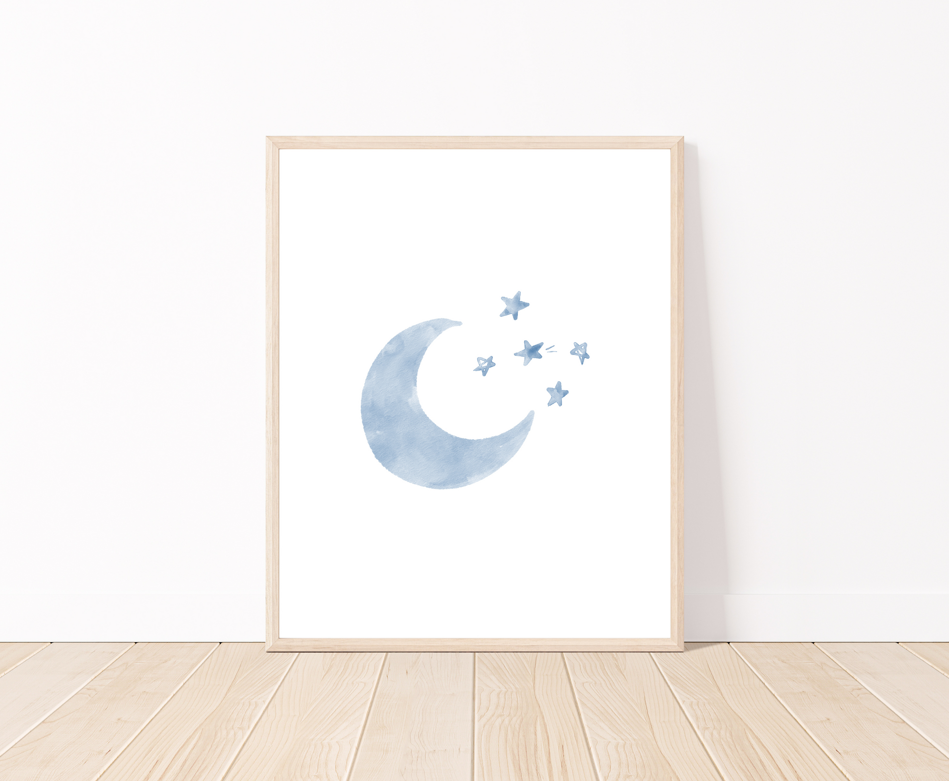 A digital poster is placed on a white wall and parquet flooring and shows a baby blue crescent and some tiny stars.