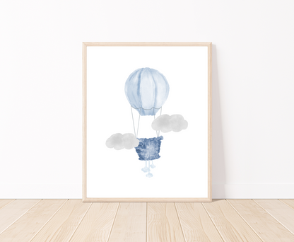 A digital poster is placed on a white wall and parquet flooring and shows a baby blue air balloon and two gray clouds.