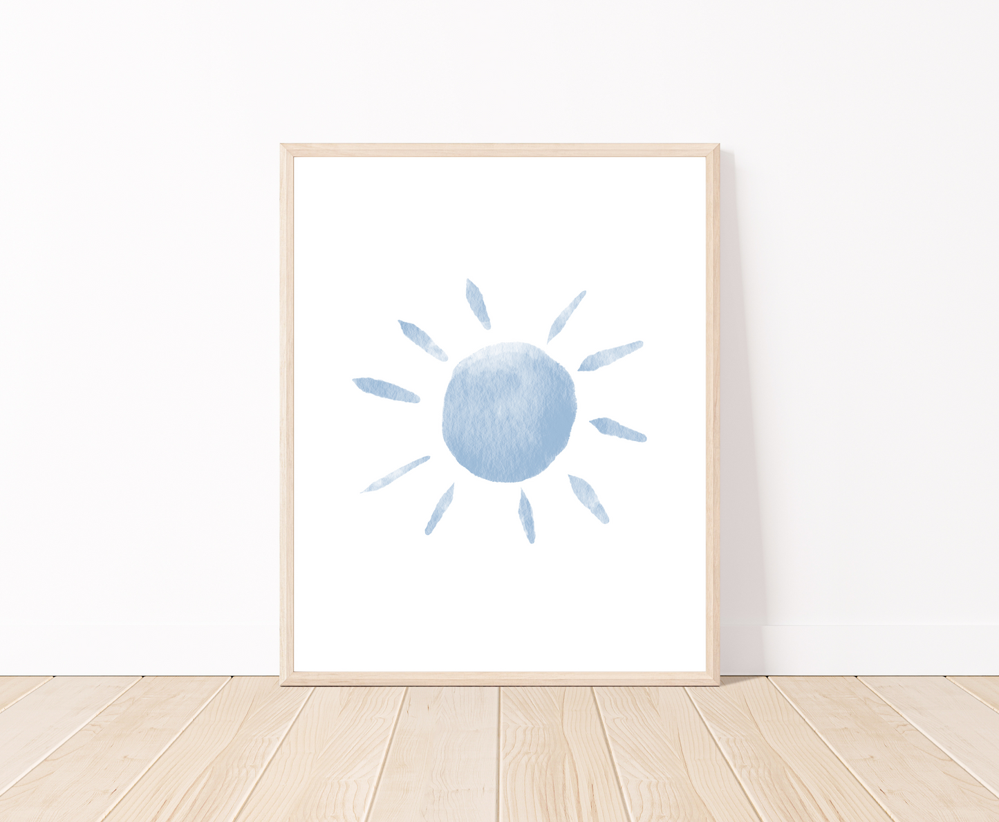 A digital poster is placed on a white wall and parquet flooring and shows a baby blue sun.