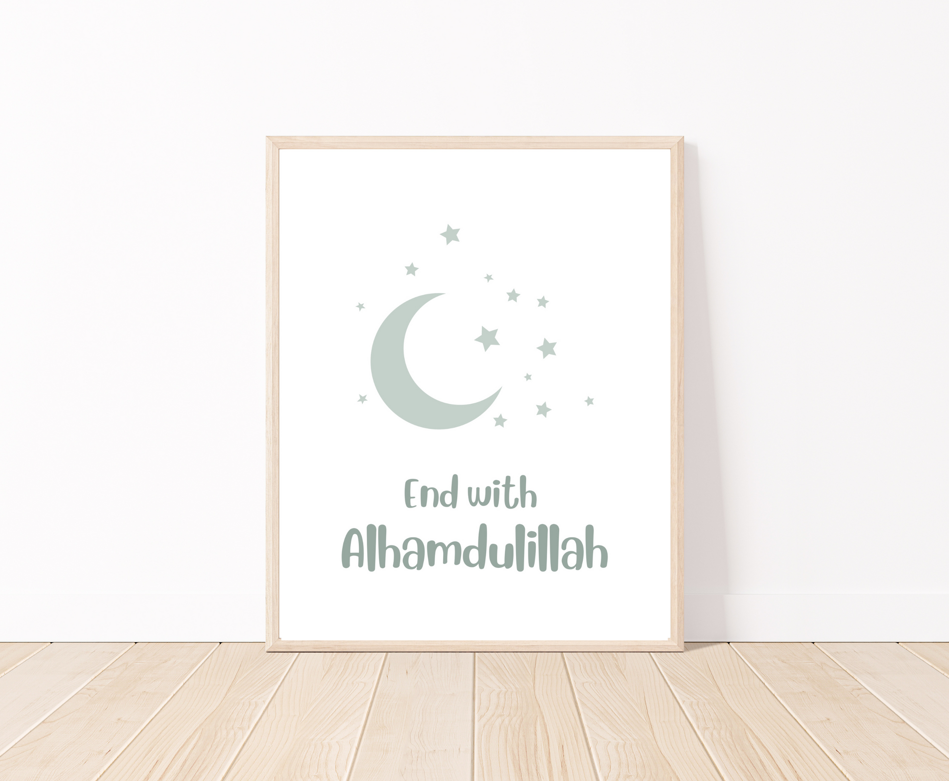 A digital poster that is placed on a white wall and parquet flooring shows a baby green crescent and tiny stars with the word “End with Alhamdulillah” written just below.