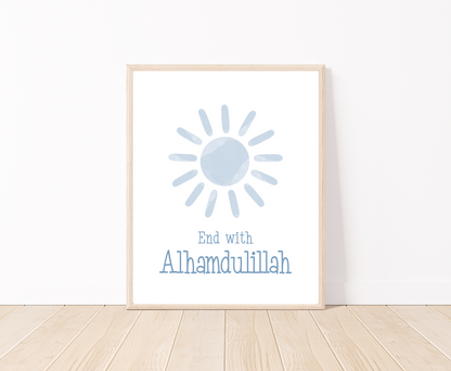 A little boy’s room digital poster that is placed on a white wall and parquet flooring shows a baby blue sun with “End with Alhamdulillah” written just below.