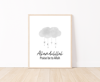 A little boy’s room digital poster that is placed on a white wall and parquet flooring shows a gray cloud design with the word “Alhamdulillah”, Praise Be to Allah below.