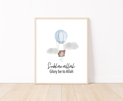 A little boy’s room digital poster that is placed on a white wall and parquet flooring shows a baby blue air balloon with the word “Subhanallah”, Glory Be to Allah, written below.