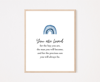 A digital poster that has a blue rainbow at the top with a piece of writing that says: “You are loved for the boy you are, the man you will become, and for the precious son you will always be.”