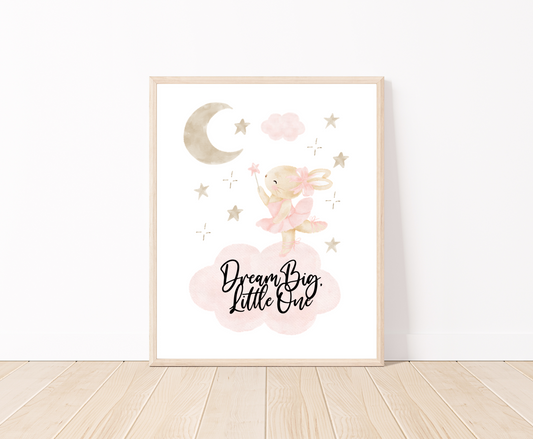 A little girl’s room graphic placed on a white wall and parquet flooring. It shows a grey-pinkish crescent with a brown teddy rabbit wearing a pink bow, with a few tiny grey-pinkish stars beside it and two pinkish clouds. It also includes a piece of writing that says “Dream Big Little One”.