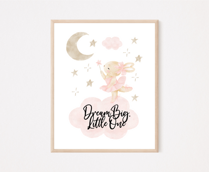A little girl’s room graphic that shows a grey-pinkish crescent with a brown teddy rabbit wearing a pink bow, with a few tiny grey-pinkish stars beside it and two pinkish clouds. It also includes a piece of writing that says “Dream Big Little One”.