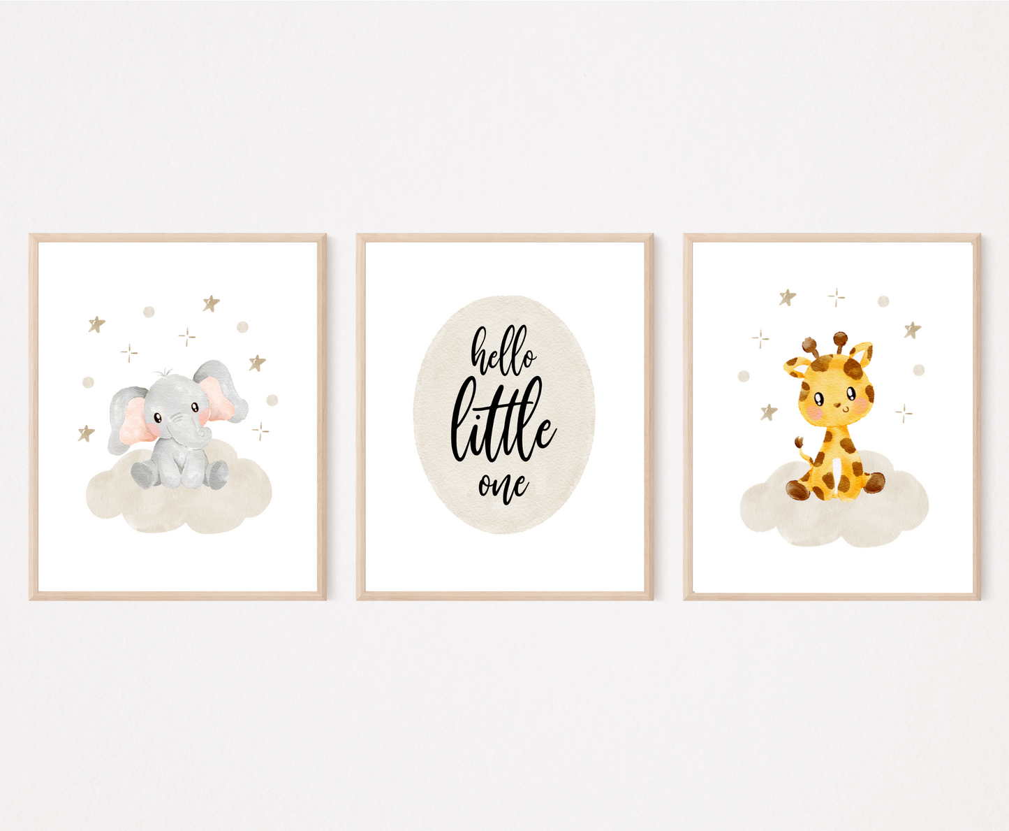 A picture of three digital printable graphics. The first one shows a graphic of a grey baby elephant sitting on a grey cloud with mini stars surrounding its head. The middle one has a piece of writing inside a grey oval shape that says “Hello little one”. The last one shows a cute baby giraffe sitting on a grey cloud with mini stars surrounding its head.