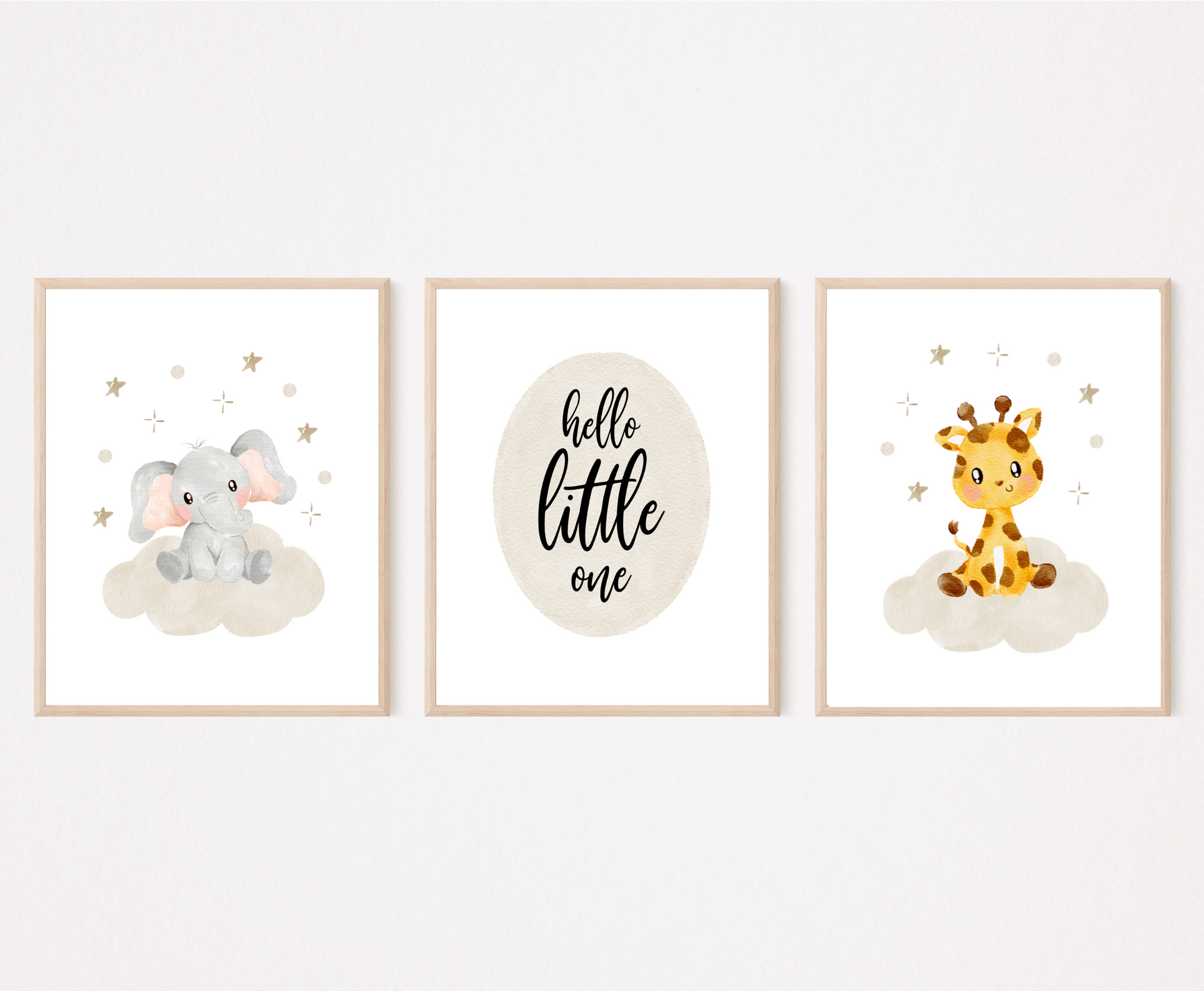 A picture of three digital printable graphics. The first one shows a graphic of a grey baby elephant sitting on a grey cloud with mini stars surrounding its head. The middle one has a piece of writing inside a grey oval shape that says “Hello little one”. The last one shows a cute baby giraffe sitting on a grey cloud with mini stars surrounding its head.