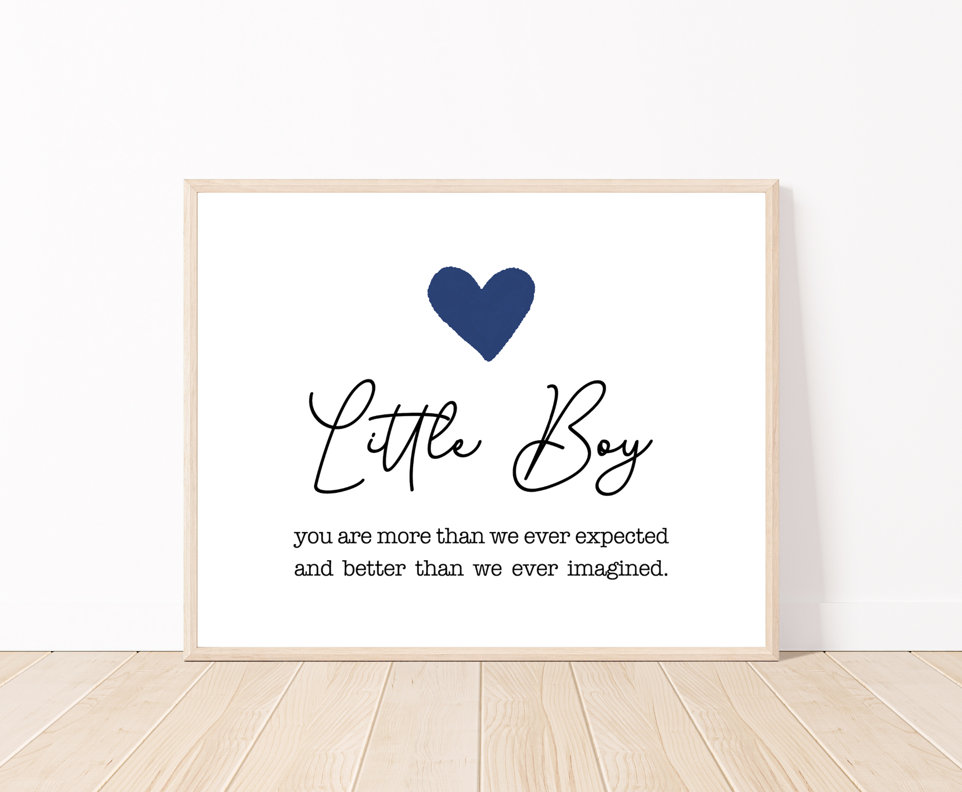 A graphic showing a dark blue heart, with a piece of writing that says, “Little boy, you are more than we ever expected, and better than we ever imagined.”