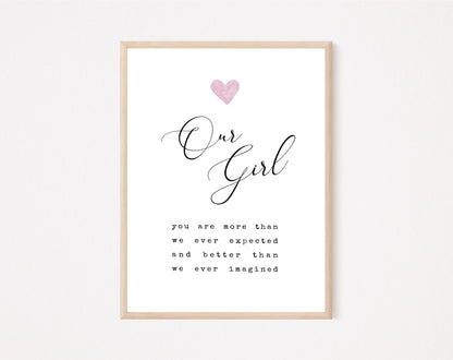 A little girl’s room digital print that has a pink heart at the top, and a piece of writing that says: “Our girl, you are more than we ever expected and better than we ever imagined.”