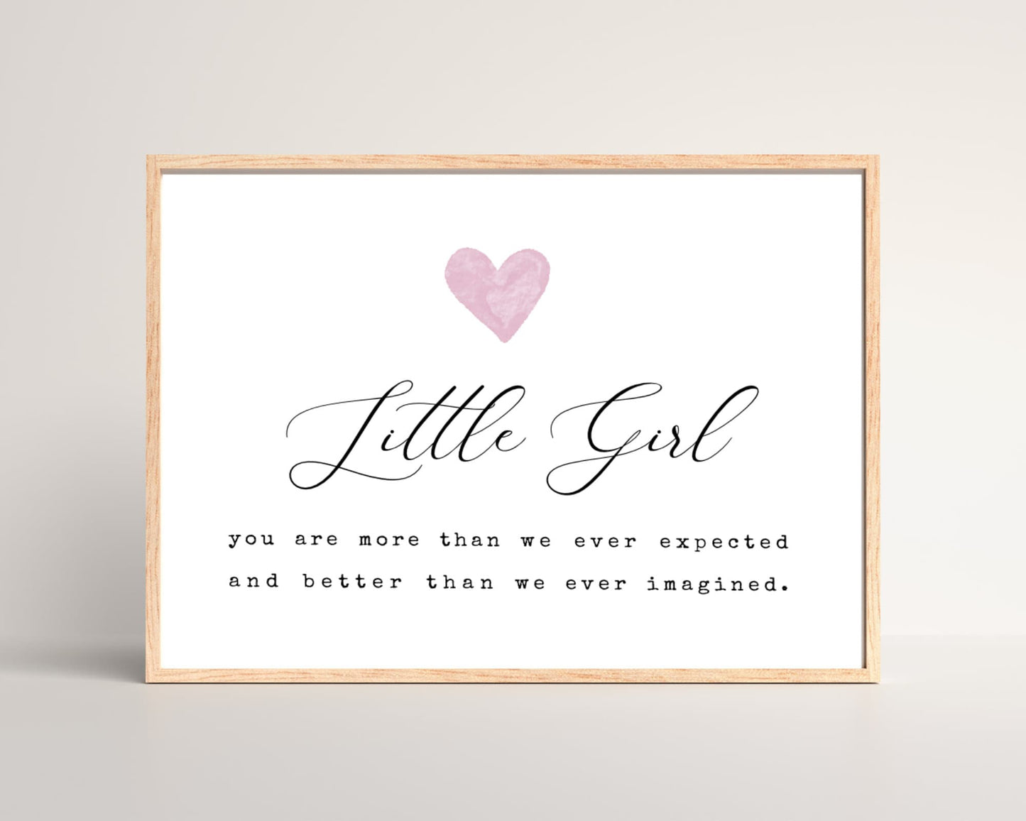A little girl’s room horizontal digital print that has a pink heart at the top, and a piece of writing that says: “Little girl, you are more than we ever expected and better than we ever imagined.”