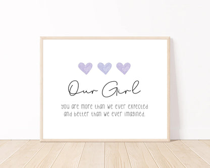 A digital poster that has three purple blue hearts, and a piece of writing below that says: Our girl, you are more than we ever expected, and better than we ever imagined.