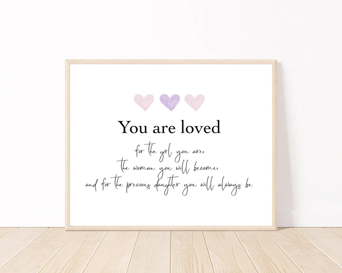 A digital poster that has three tiny pink and purple hearts, and a piece of writing below that says: You are loved, for the girl you are, the woman you will become, and for the precious daughter you will always be.