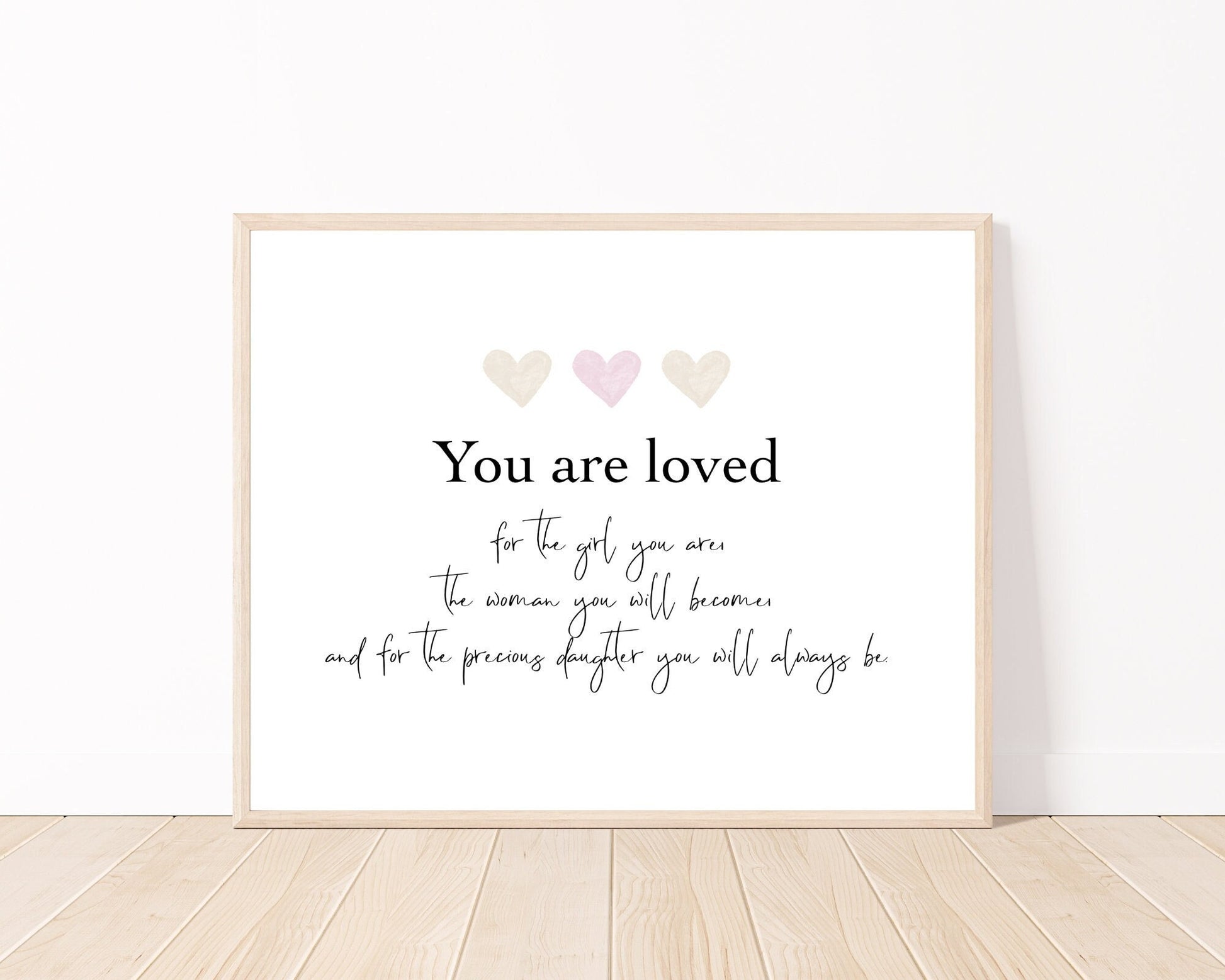 A little girl’s graphic showing three baby pink and beige hearts with a piece of writing below that says: You are loved, for the girl you are, the woman you will become, and for the precious daughter you will always be.