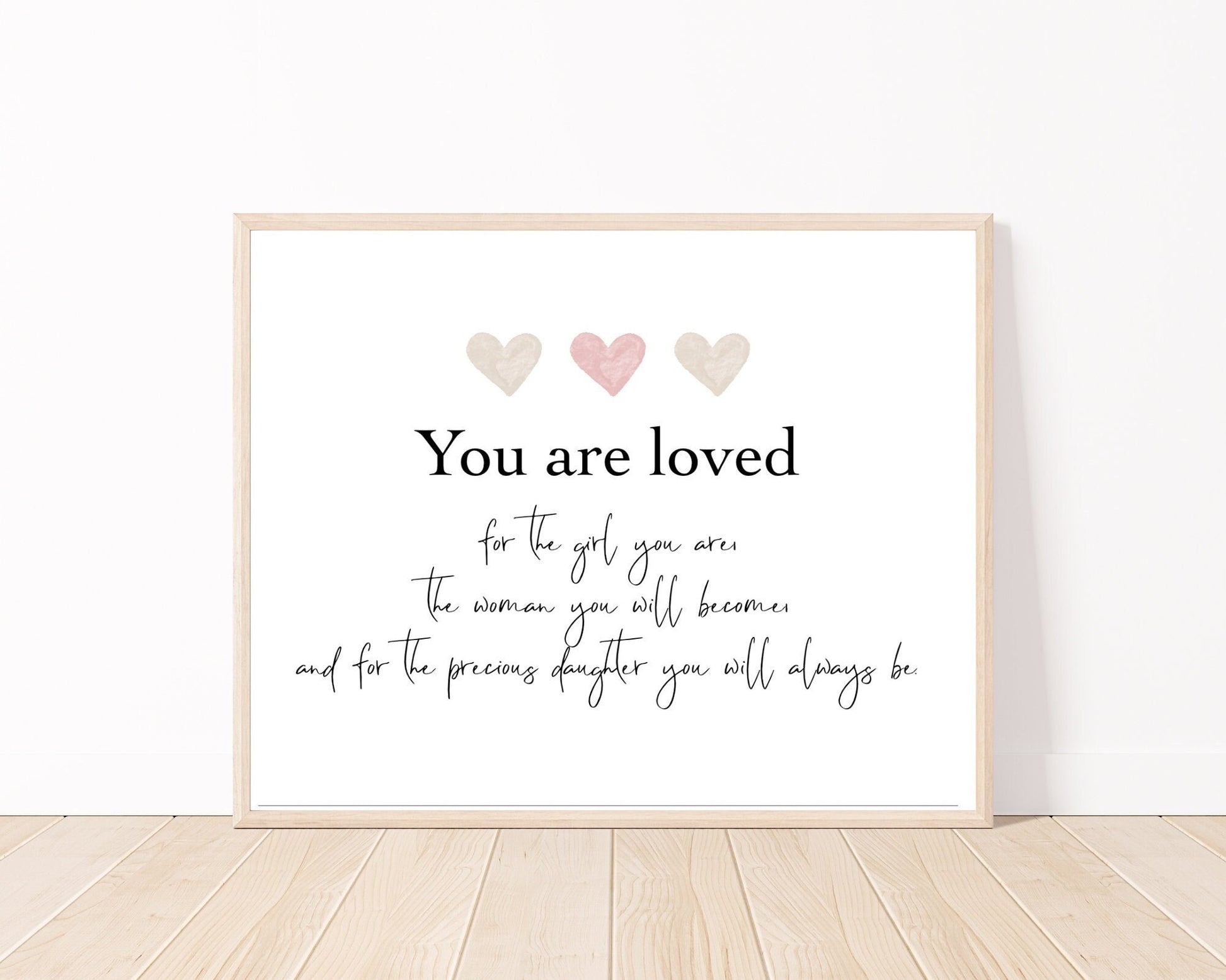 A little girl’s graphic showing three pink and beige hearts with a piece of writing below that says: You are loved, for the girl you are, the woman you will become, and for the precious daughter you will always be.