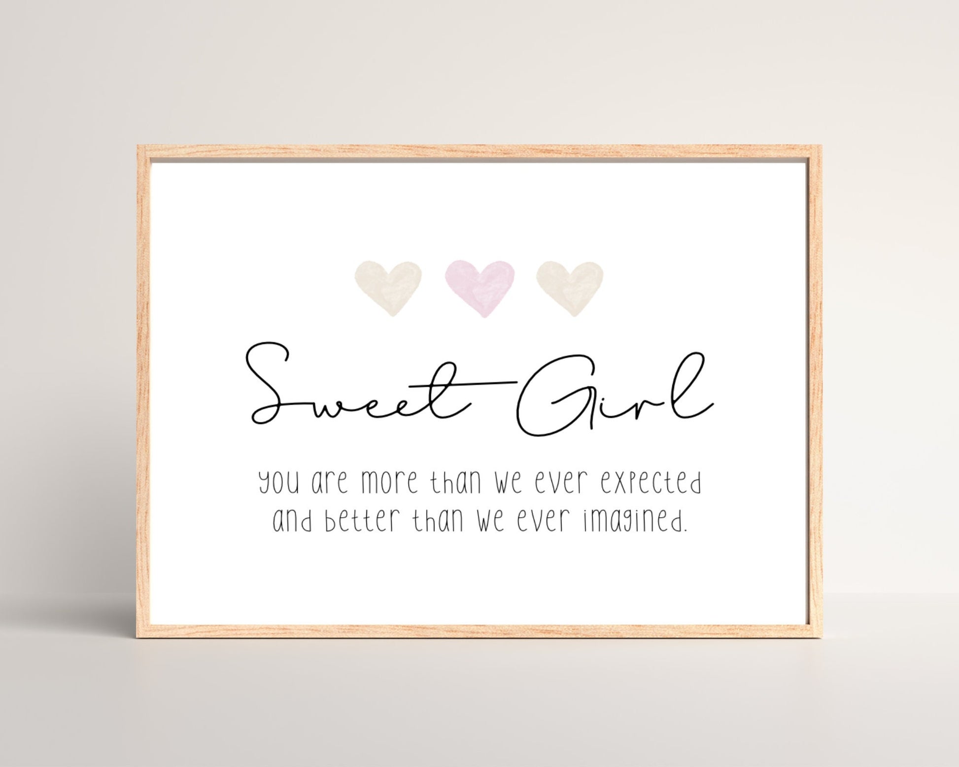 A little girl’s room digital print that has three hearts at the top, and a piece of writing that says: “Sweet girl, you are more than we ever expected and better than we ever imagined.”