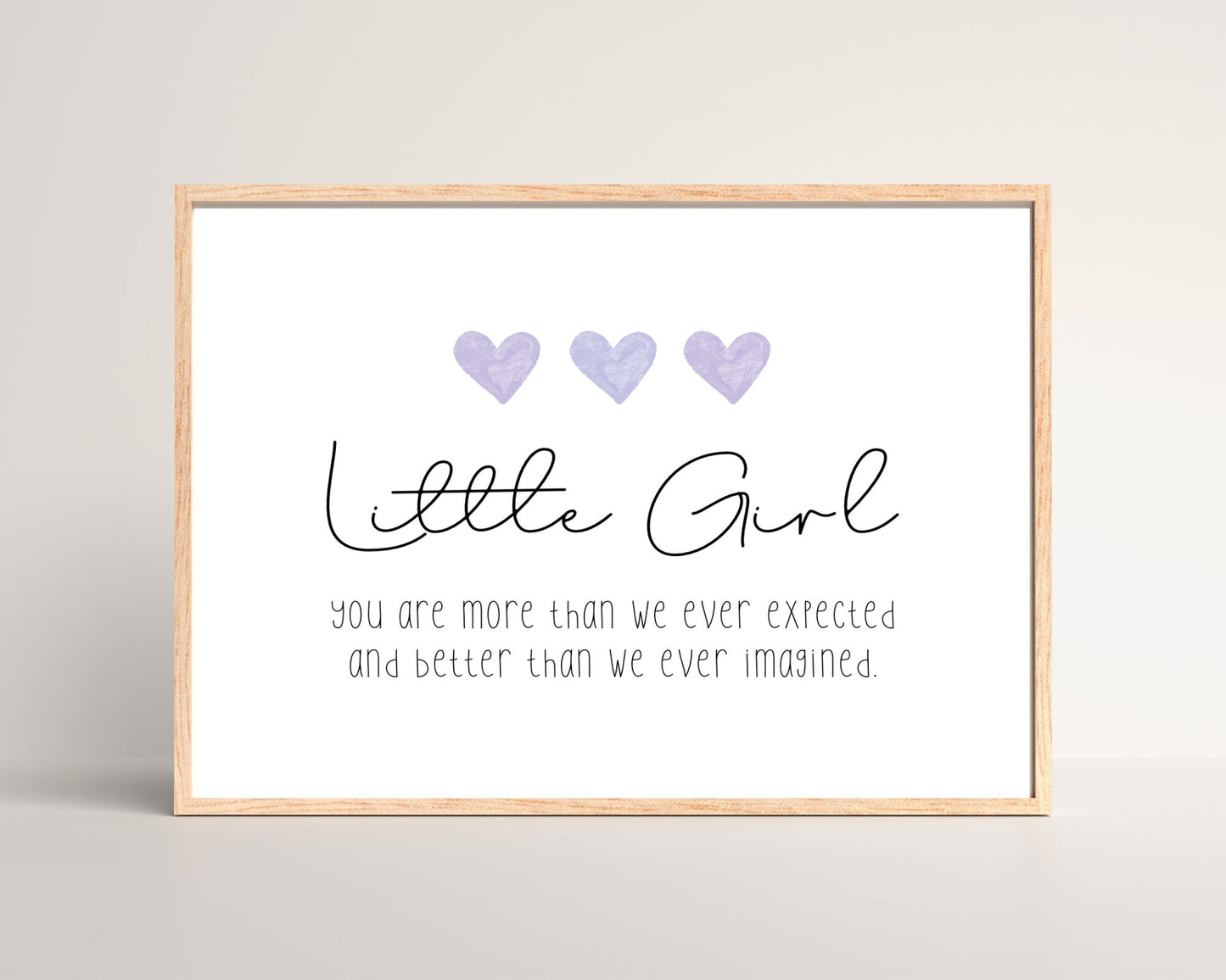 A little girl’s room digital print that has three purple hearts at the top, and a piece of writing that says: “Little girl, you are more than we ever expected and better than we ever imagined.”