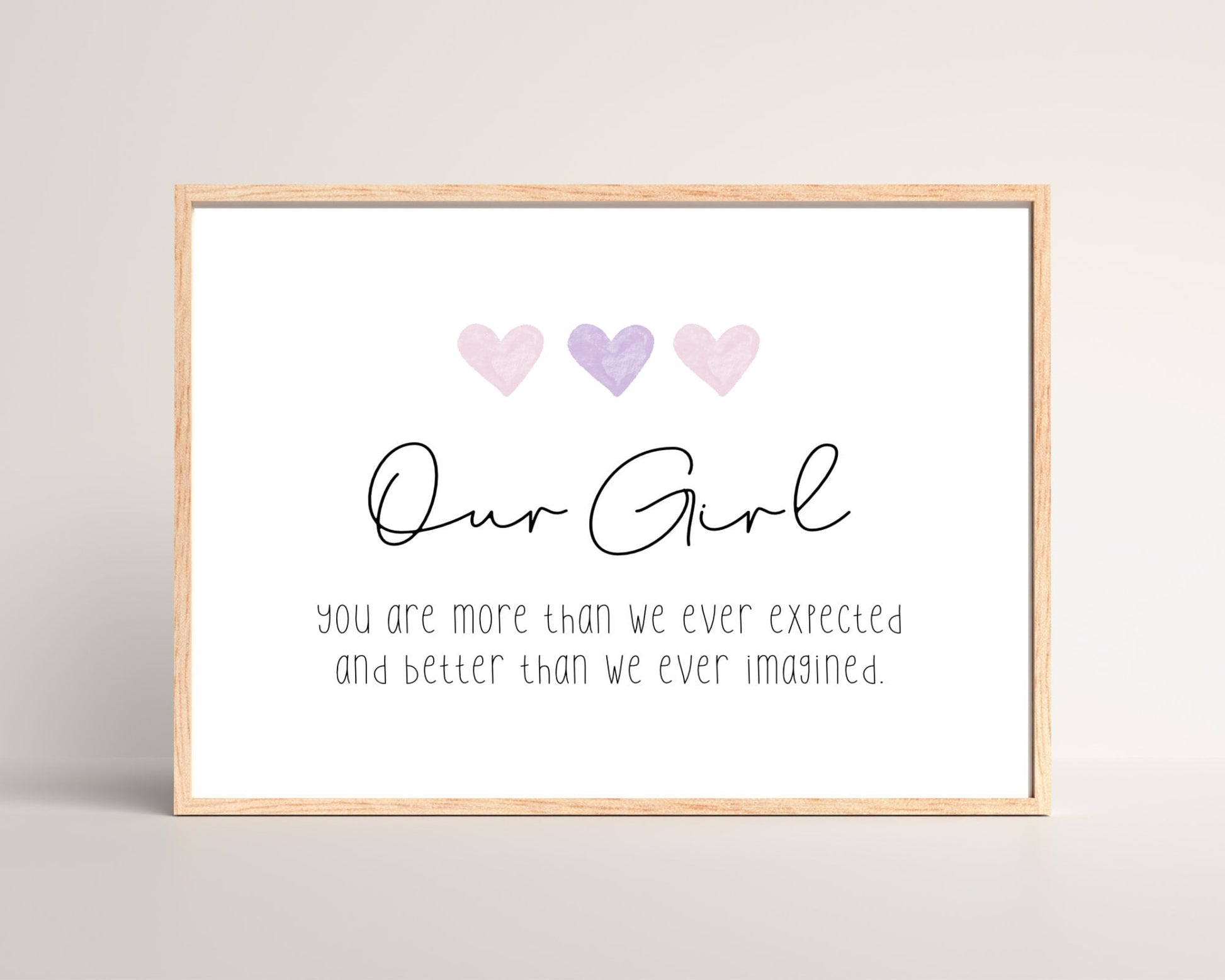 A little girl’s room digital print that has three pink hearts at the top, and a piece of writing that says: “Our girl, you are more than we ever expected and better than we ever imagined.”