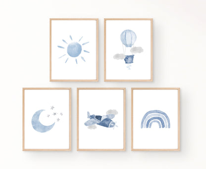 An image showing five graphics. The first one shows a blue sun, while the second one shows a blue air balloon with two grey clouds. The third one shows a baby blue crescent and some tiny blue stars beside it. The fourth one shows a blue classic air plane and two grey clouds. The last image shows a blue ombre design.