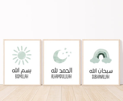 An image showing three digital print graphics placed on a white wall and parquet flooring. The first frame shows a graphic of a baby green crescent and some tiny stars with “Alhamdulillah” written in both Arabic and English right below. The second is a baby green rainbow with “Subhanallah” in both Arabic and English written just below it. The last one is for a baby green sun with “Bismillah” written in both Arabic and English.