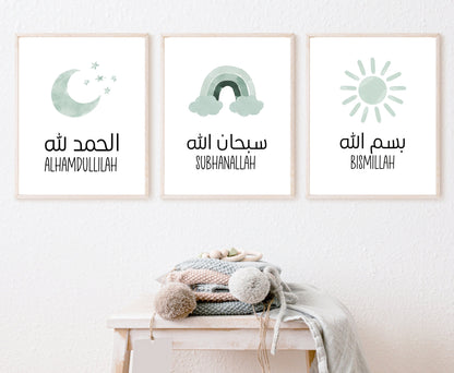 An image showing three digital print graphics that are hung on a wall. The first frame shows a graphic of a baby green crescent and some tiny stars with “Alhamdulillah” written in both Arabic and English right below. The second is a baby green rainbow with “Subhanallah” in both Arabic and English written just below it. The last one is for a baby green sun with “Bismillah” written in both Arabic and English.